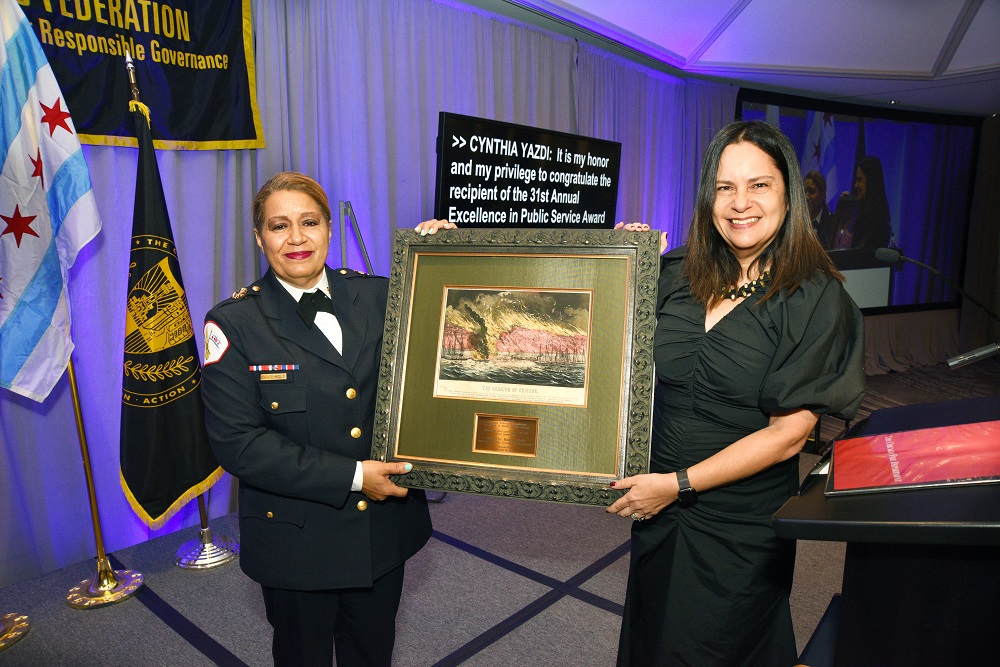 Chicago Fire Commissioner Annette Nance-Holt receives the 31st Annual Motorola           Solutions Foundation Excellence in Public Service Award from Cynthia Yazdi,           senior vice president of communications and brand at Motorola Solutions.